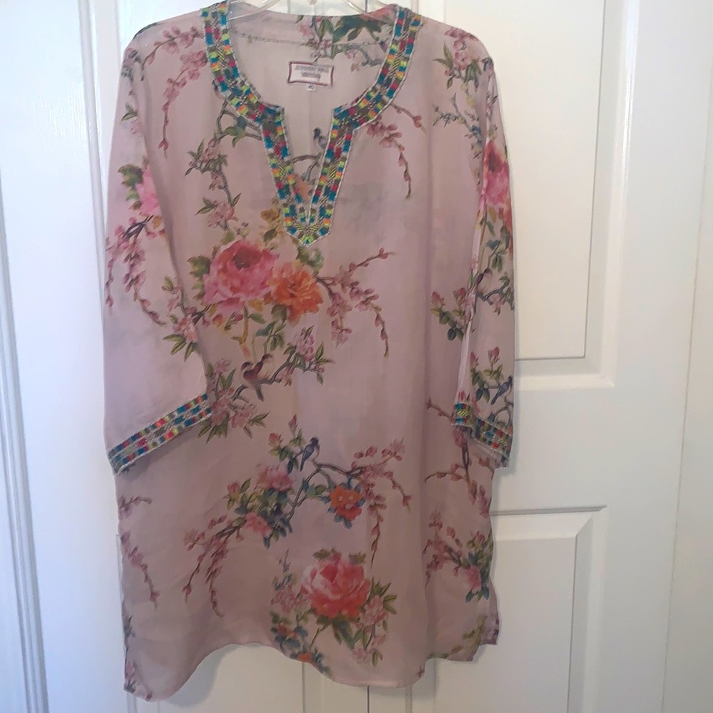 Johnny was Tunic XL pink with flowers and a trim on the sleeves and neck line